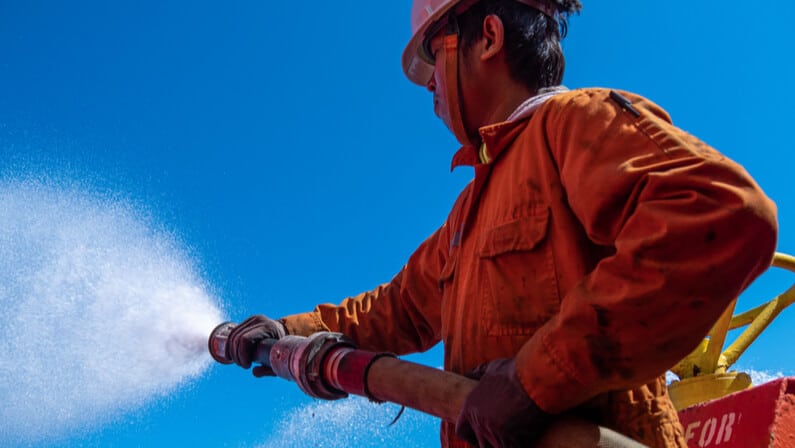 Basic Safety Officer using fire hose