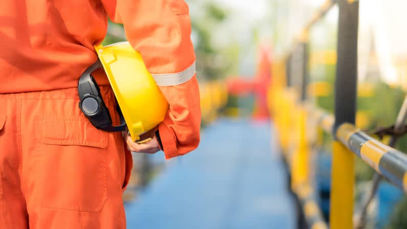 Oil field worker with safety gear