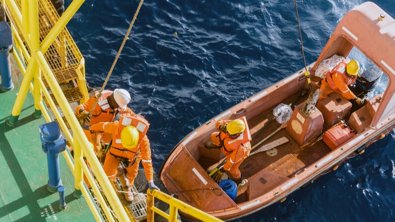 Seafarer checking fast rescue craft