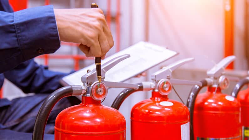 fire watcher checking the fire extinguisher