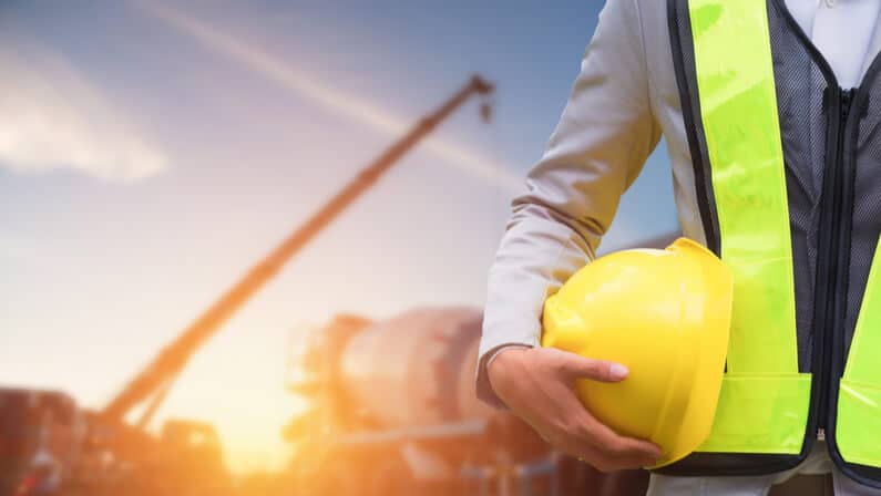 worker on a safety working environment holding yellow hat